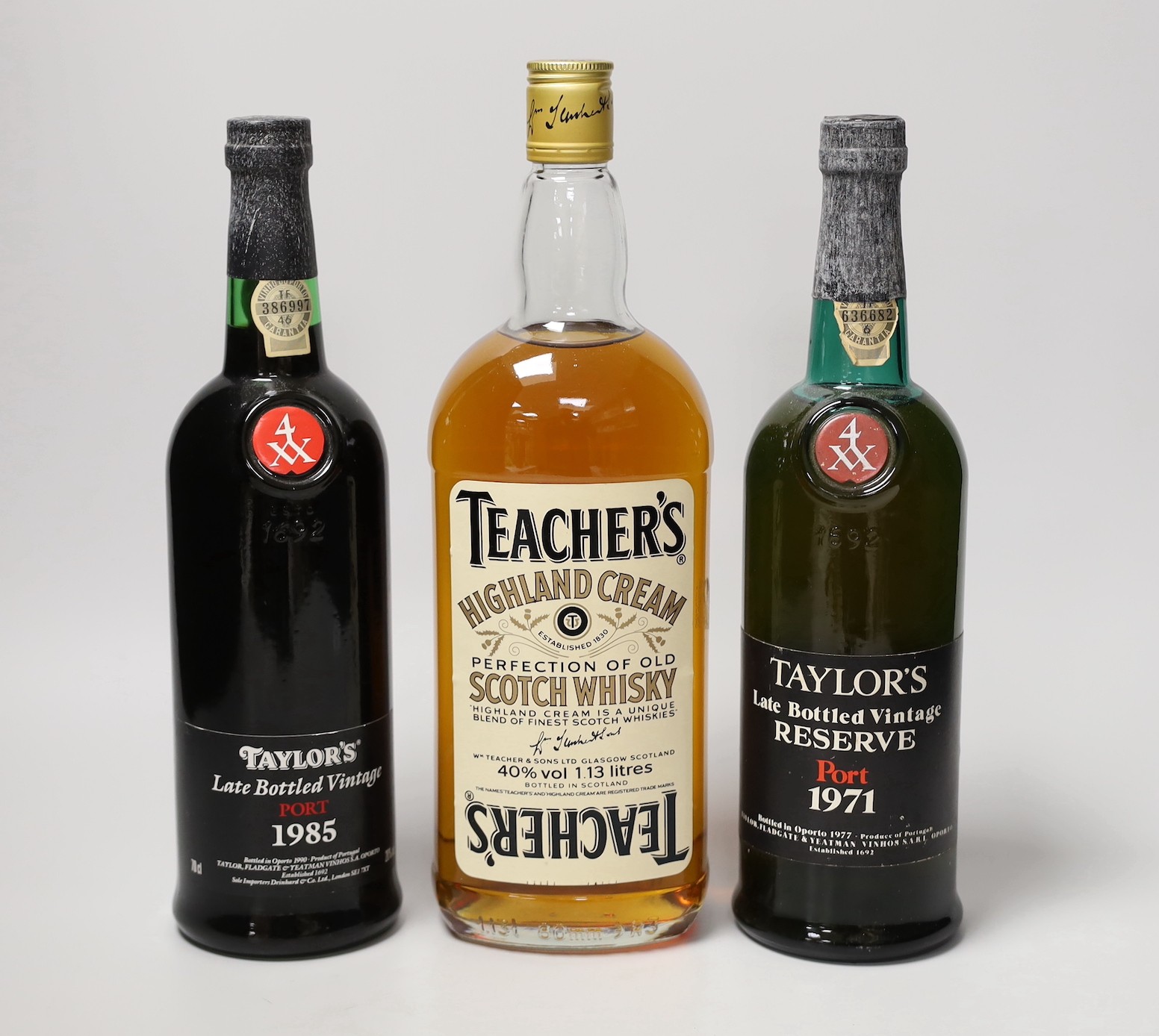 Two bottles of Taylor's Late Vintage Port 1971 and 1985 and a bottle of Teacher's whisky